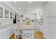 Modern kitchen featuring white cabinets and granite countertops at 29249 Wilpayne Rd, Brooksville, FL 34602