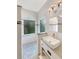 Clean bathroom with single vanity, walk-in shower and subway tile at 18122 Sugar Brooke Dr, Tampa, FL 33647