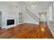 Living room with hardwood floors and staircase at 18122 Sugar Brooke Dr, Tampa, FL 33647