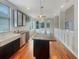Modern kitchen with dark cabinets, granite island, and stainless steel appliances at 18122 Sugar Brooke Dr, Tampa, FL 33647