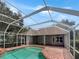 Inviting screened pool with brick pavers at 18122 Sugar Brooke Dr, Tampa, FL 33647