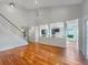 Open living room with hardwood floors and kitchen views at 18122 Sugar Brooke Dr, Tampa, FL 33647