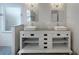 Elegant bathroom with double vanity, white subway tile, and modern fixtures at 18122 Sugar Brooke Dr, Tampa, FL 33647