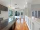 Bright and spacious kitchen and dining area with hardwood floors, granite countertops and access to the pool at 18122 Sugar Brooke Dr, Tampa, FL 33647
