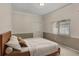 Cozy bedroom with natural light, featuring a neutral color palette and soft textures at 13102 Prestwick Dr, Riverview, FL 33579