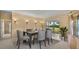 Elegant dining room with modern decor and a view of the backyard at 13102 Prestwick Dr, Riverview, FL 33579