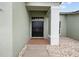 Inviting front entrance featuring a double door entry and manicured landscaping, welcoming you home at 13102 Prestwick Dr, Riverview, FL 33579