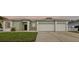 Inviting front exterior with a well-maintained lawn and a three-car garage at 13102 Prestwick Dr, Riverview, FL 33579