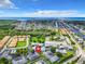 Stunning aerial view of the community with coastal access and lush greenery with water views in the background at 4844 Booth Bay Dr, New Port Richey, FL 34652