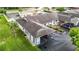 Overhead view of condominium complex showing roof, carport parking, and lush landscaping at 4844 Booth Bay Dr, New Port Richey, FL 34652