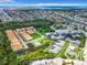 An aerial view reveals this coastal community, highlighting its serene waterways, landscaped grounds, and lush surrounding greenery at 4844 Booth Bay Dr, New Port Richey, FL 34652