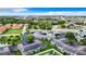 Aerial view showcasing the community's well-maintained landscaping, charming townhomes, and nearby coastal location at 4844 Booth Bay Dr, New Port Richey, FL 34652