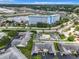 Scenic aerial view of a blue and white condo community near a tranquil marina and a lush green landscape at 4844 Booth Bay Dr, New Port Richey, FL 34652