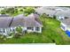 An aerial view of a well-maintained residential property with lush landscaping and a serene neighborhood setting at 4844 Booth Bay Dr, New Port Richey, FL 34652