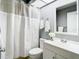 Bathroom featuring a shower and tub combination with neutral gray walls and white vanity at 4844 Booth Bay Dr, New Port Richey, FL 34652