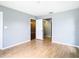 Neutral bedroom with wood flooring and closet with door off at 4844 Booth Bay Dr, New Port Richey, FL 34652