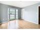 Bedroom with a bay window, wood floors, and ample lighting at 4844 Booth Bay Dr, New Port Richey, FL 34652