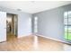 Bedroom with hardwood flooring and plenty of natural light at 4844 Booth Bay Dr, New Port Richey, FL 34652