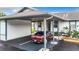 A well-maintained carport provides covered parking with an exterior patio area for relaxing outdoors at 4844 Booth Bay Dr, New Port Richey, FL 34652