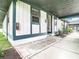 Entrance to condo with a tiled front stoop and outdoor lighting at 4844 Booth Bay Dr, New Port Richey, FL 34652