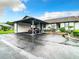 Welcoming home exterior with a carport, clean paint, and mature landscaping at 4844 Booth Bay Dr, New Port Richey, FL 34652