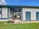 Exterior image of the property featuring painted siding and a covered walkway at 4844 Booth Bay Dr, New Port Richey, FL 34652