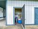 Interior storage room showcases shelving and essentials, situated beside an open doorway at 4844 Booth Bay Dr, New Port Richey, FL 34652