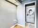 Small bathroom with white vanity and access from hallway at 4844 Booth Bay Dr, New Port Richey, FL 34652