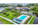 Aerial view of community pool, landscaping, and nearby buildings at 4844 Booth Bay Dr, New Port Richey, FL 34652