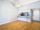 Dining room with wood floors and kitchen bar at 4844 Booth Bay Dr, New Port Richey, FL 34652