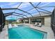 Resort-style pool with covered patio and plenty of lounge space at 9120 Warm Springs Cir, Parrish, FL 34219