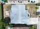 Aerial view of a single Gathering home and surrounding yard at 1747 Font Ln, Holiday, FL 34691