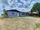 Features a home with a large backyard and partial fencing at 1747 Font Ln, Holiday, FL 34691