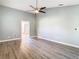 Primary bedroom with ceiling fan and French doors at 9375 Bearwalk Path, Weeki Wachee, FL 34613