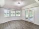 Spacious dining room with wood flooring and French doors at 9375 Bearwalk Path, Weeki Wachee, FL 34613