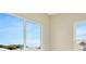 Bright bedroom with large windows and walk-in closet at 10661 Torchwood Sea Way, San Antonio, FL 33576