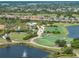 Breathtaking aerial shot featuring a golf course, multiple ponds, and a beautiful community at 5243 Esplanade Blvd, Bradenton, FL 34211