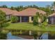 Lovely home with lush landscaping, lawn and water view at 5243 Esplanade Blvd, Bradenton, FL 34211