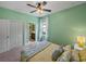 Comfortable bedroom with a large window, double door closet, and ensuite bathroom at 5243 Esplanade Blvd, Bradenton, FL 34211