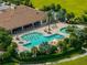 An aerial image highlights a community pool, lounge areas, and landscaped surroundings, creating an inviting outdoor space at 5243 Esplanade Blvd, Bradenton, FL 34211