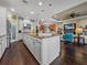 Spacious open kitchen with large island and stainless steel appliances overlooking living area at 5243 Esplanade Blvd, Bradenton, FL 34211
