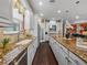 Beautiful kitchen features a large island, stainless steel appliances, and granite counters at 5243 Esplanade Blvd, Bradenton, FL 34211