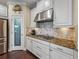 Beautiful gourmet kitchen features stainless steel appliances, granite counters, and tile backsplash at 5243 Esplanade Blvd, Bradenton, FL 34211