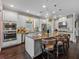 Bright kitchen featuring stainless steel appliances, a large island with seating, and pendant lighting at 5243 Esplanade Blvd, Bradenton, FL 34211