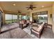 Spacious covered lanai with comfortable seating and lush backyard views at 5243 Esplanade Blvd, Bradenton, FL 34211
