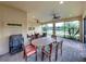 Beautiful outdoor patio with both dining and seating areas with views of the pond at 5243 Esplanade Blvd, Bradenton, FL 34211