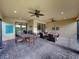 Spacious outdoor patio with dining, seating, and relaxing backyard views at 5243 Esplanade Blvd, Bradenton, FL 34211