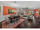Open concept living area showcasing a dining table and a cozy seating arrangement with a fireplace feature at 5243 Esplanade Blvd, Bradenton, FL 34211