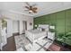 Tranquil bedroom features accent wall, trey ceiling, and a view into the main bathroom at 5243 Esplanade Blvd, Bradenton, FL 34211