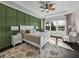 Tranquil bedroom with green accent wall, trey ceiling, and a scenic view of the water at 5243 Esplanade Blvd, Bradenton, FL 34211